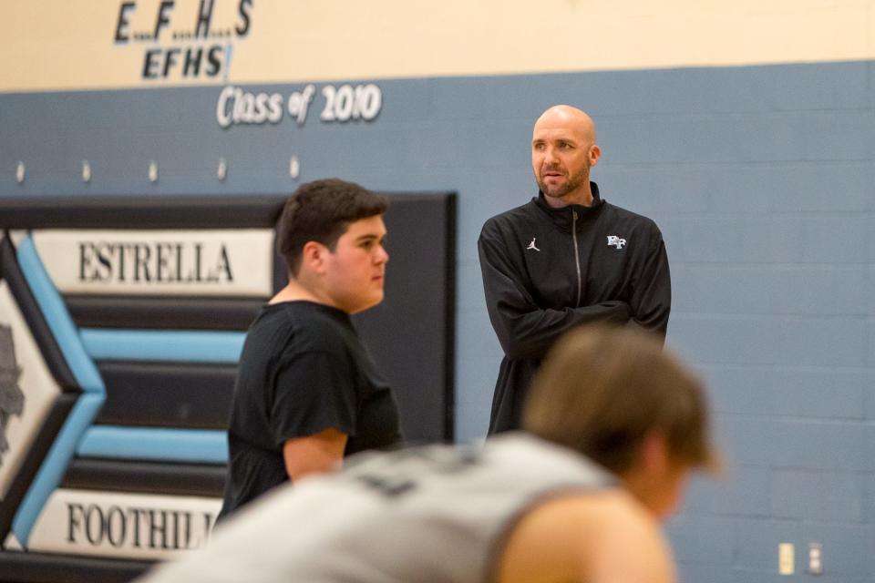 Buckeye Union High School District Unified Basketball assistant coach Chad Williams watches practice in the Estrella Foothills High School gym in Goodyear, Ariz., on Jan 24, 2022.