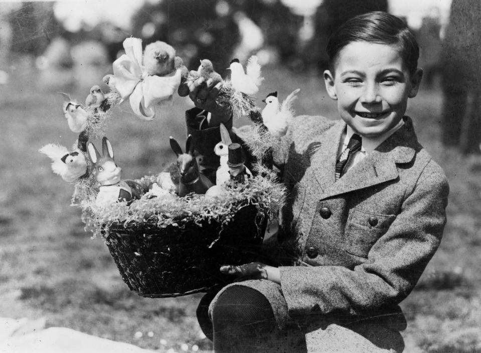 <p>Warren Sonnemann holds up a prize Easter basket at the White House Easter Egg Rolling, April 2, 1923, in Washington. </p>