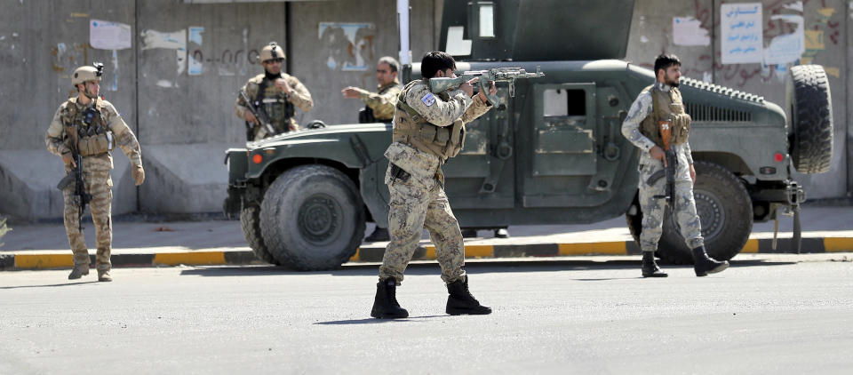 Afghan security forces guard the site of a suicide attack near the U.S. Embassy in Kabul, Afghanistan, Tuesday, Sept. 17, 2019. Hours earlier Afghan officials said a suicide bomber rammed his motorcycle packed with explosives into the entrance to a campaign rally of President Ashraf Ghani in northern Parwan province, killing over 20 people and wounding over 30. Ghani was present at the venue but was unharmed. The Taliban have claimed both attacks. (AP Photo/Ebrahim Noroozi)
