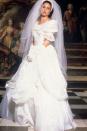 <p>In one of the four weddings that took place in <em>Four Weddings and a Funeral</em><em>,</em> Carrie (Andie MacDowell) wore an off-the-shoulder, A-line ball gown with a draped skirt.<br></p>