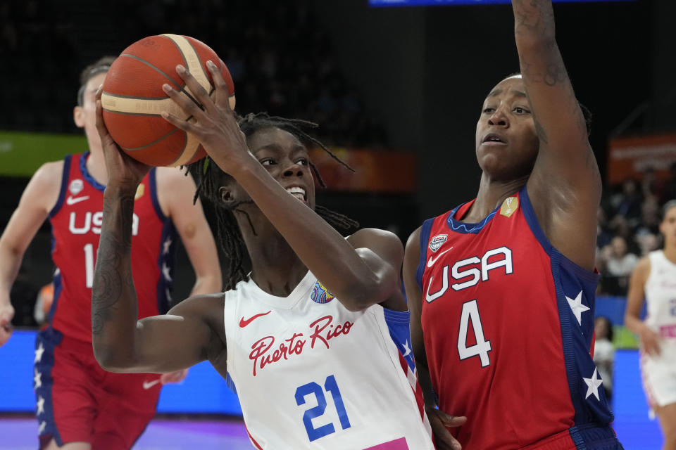 Puerto Rico's Mya Hollingshed tries to shoot past United States' Jewell Loyd at the women's Basketball World Cup in Sydney, Australia, Friday, Sept. 23, 2022. (AP Photo/Mark Baker)