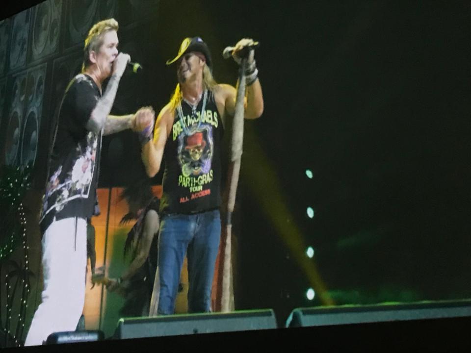 Mark McGrath teaming up with Bret Michaels in this jumbo screen shot from the Pardi Gras show at The Pavilion at Star Lake.