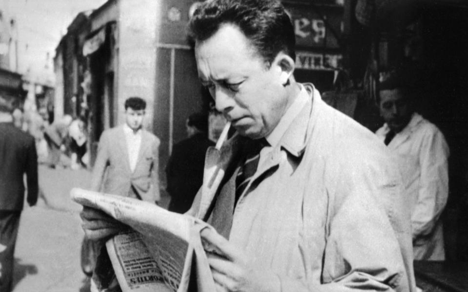 French writer Albert Camus smoking in Paris in 1959 - AFP