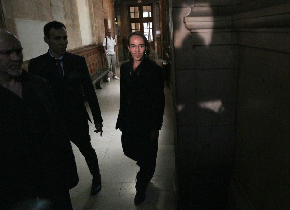fashion designer john galliano is seen as he arrives at the paris court hall for his trial on june 22, 2011 the british designer was facing trial on charges he launched anti semitic tirades in a paris bar, which the fallen superstar is expected to blame on drug and alcohol addiction the 50 year old couturier considered one of the finest fashion designers of his generation could face a sentence of six months in jail and a fine of 22,500 euros $32,000 if convicted afp photo jacques demarthon photo credit should read jacques demarthonafp via getty images