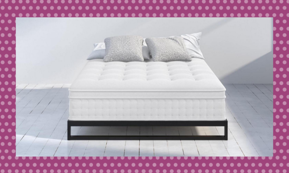 A memory foam mattress with two pillows on top