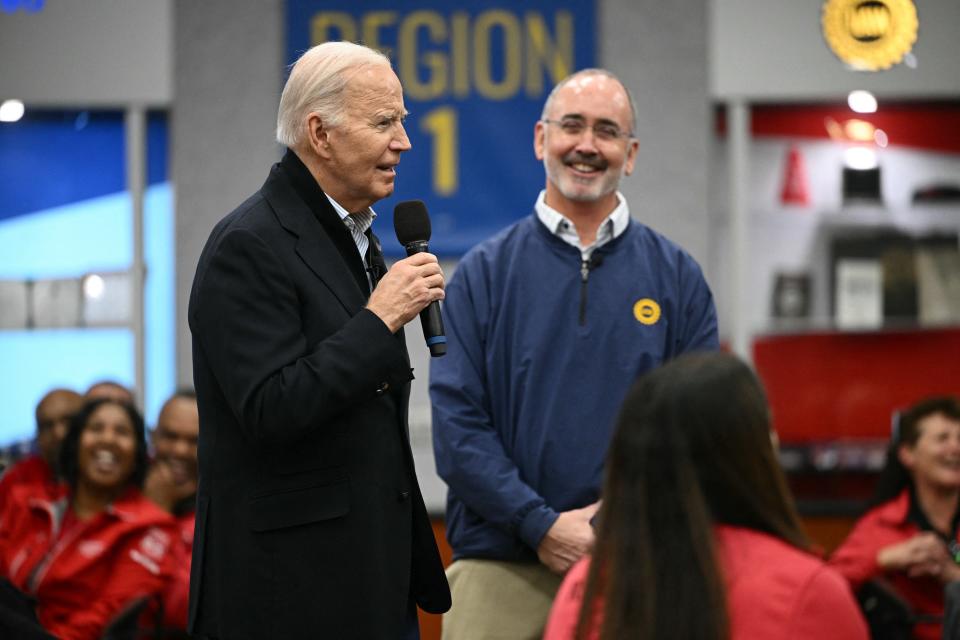 President Joe Biden speaks to members of the United Auto Workers at the UAW National Training Center, in Warren, Michigan, on Feb. 1 as UAW President Shawn Fain listens.