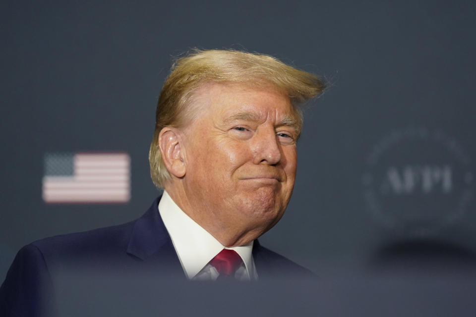 Former President Donald Trump arrives to speak at an America First Policy Institute agenda summit at the Marriott Marquis in Washington, Tuesday, July 26, 2022. (AP Photo/Andrew Harnik)