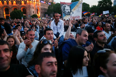 Supporters of Armenian opposition leader Nikol Pashinyan attend a rally against the ruling elite in Yerevan, Armenia April 26, 2018. REUTERS/Gleb Garanich