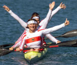 German kayaker gold medallist Katrin Wagner (F), Manuela Mucke, Anett Schuck and Birgit Fischer celebrate after women's K4 500M final, 30 September 2000, on Penrith Lake, west of Sydney. Hungarians Szilvia Szabo, Rita Koban, Katalin Kovacs and Erzsebet Viski took silver medal while Romanians Mariana Limbau, Raluca Andreea Ionita, Elena Radu and Sanda Toma took the bronze medal. AFP PHOTO /GERARD JULIEN