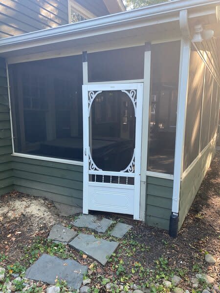 Before: The original screened-in porch at the rear of the home was demolished. It was rebuilt and enclosed, then turned into a sunroom adjacent to the kitchen.