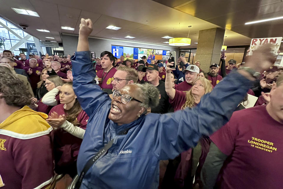 Minnesota State Trooper Ryan Londregan's attorney Chris Madel is drowned out by protesters after a hearing for his client at the Hennepin County Government Center on Monday, April 29, 2024, in Minneapolis, Minn. Longdregan is charged with killing Ricky Cobb II during a during a traffic stop in the summer of 2023. (AP Photo/Mark Vancleace)