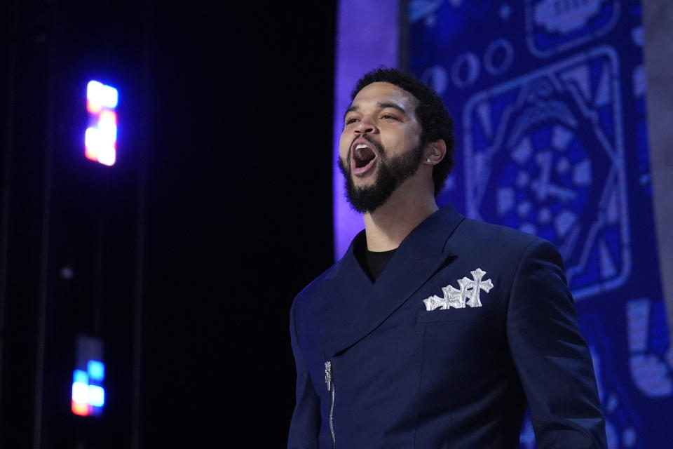 Southern California quarterback Caleb Williams walks on stage before the first round of the NFL football draft, Thursday, April 25, 2024, in Detroit. (AP Photo/Jeff Roberson)