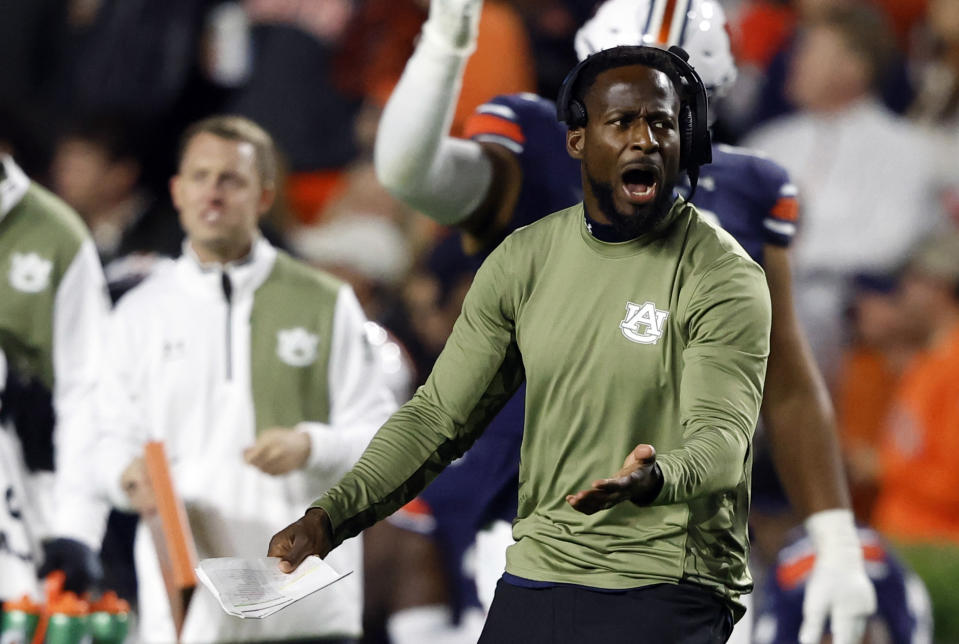 Auburn interim head coach Carnell Williams reacts during the first half of an NCAA college football game against Texas A&M, Saturday, Nov. 12, 2022, in Auburn, Ala. (AP Photo/Butch Dill)