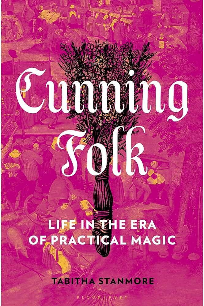 The hot-pink book jacket has a broom made of dried flowers on it.