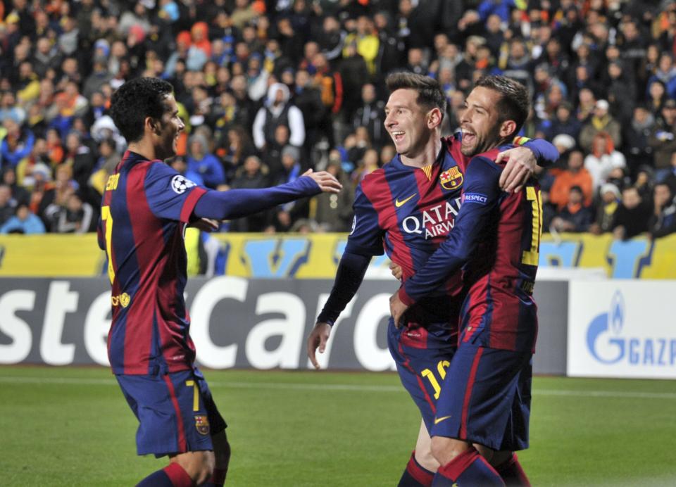 Barcelona's Lionel Messi celebrates with team mates after scoring a goal during their Champions League Group F soccer match against APOEL Nicosia at GSP Stadium in Nicosia