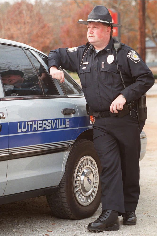 Richard Jewell, stands by one of the department's patrol cruisers in the small Georgia town of Luthersville, where he was hired after the '96 Atlanta Olympic bombing | Erik S Lesser/AP/Shutterstock