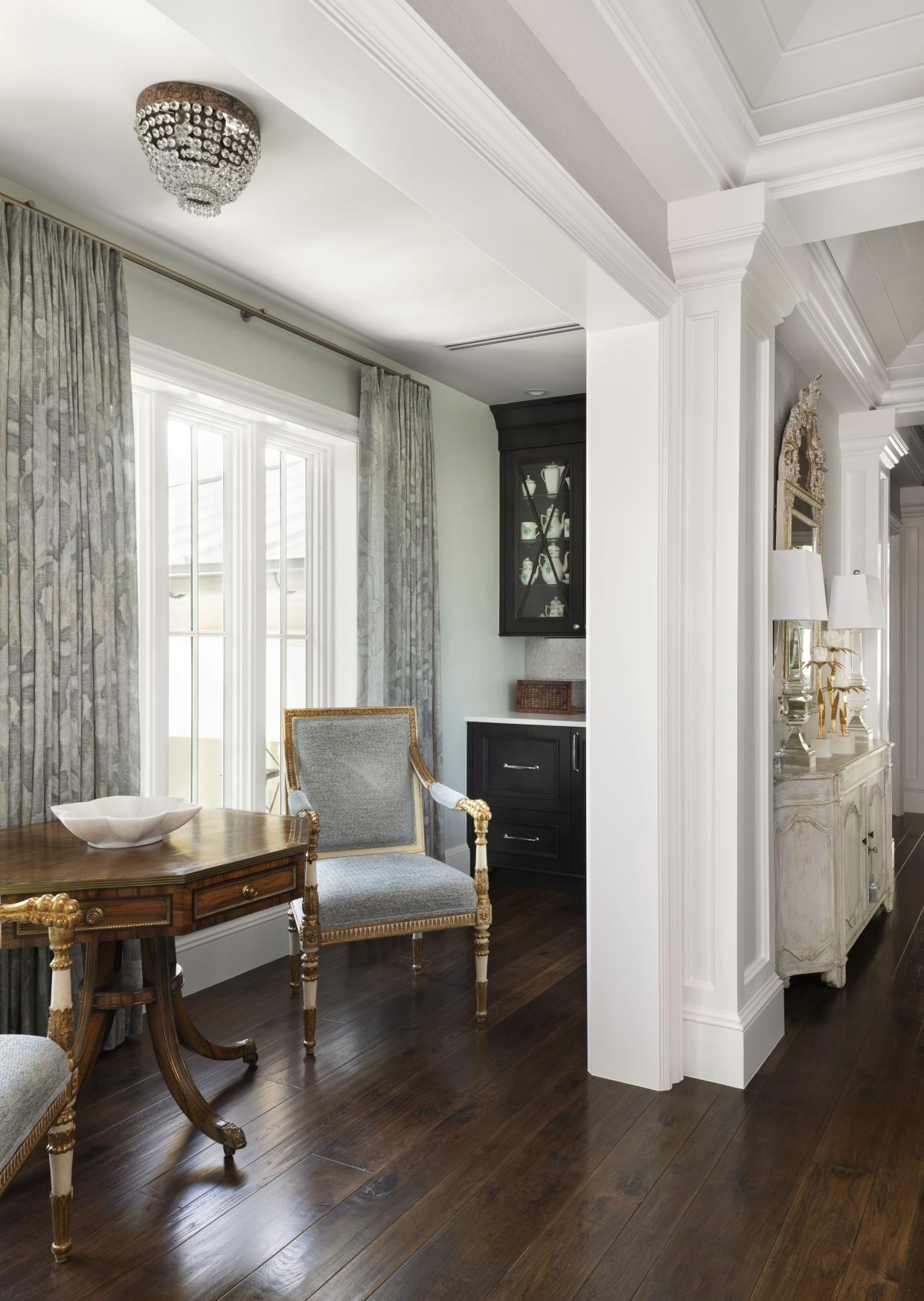 The master suite encompasses the entire upper level. This breakfast bar area features an authentic Louis XIV table.