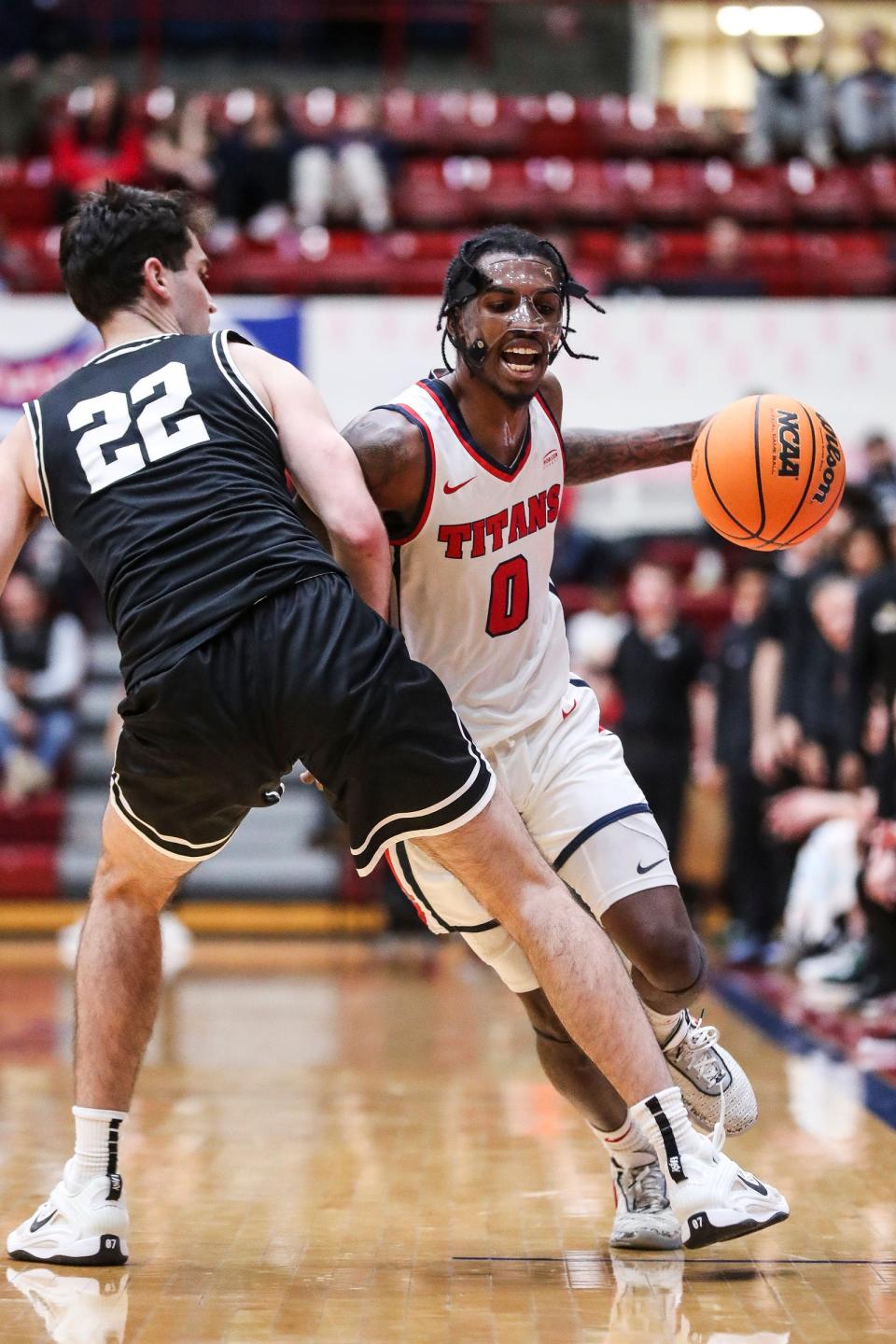 Detroit Mercy guard Antoine Davis (0) is defended by Wright State guard Andrew Welage (22) during the second half at Calihan Hall in Detroit on Saturday, Feb. 25, 2023.