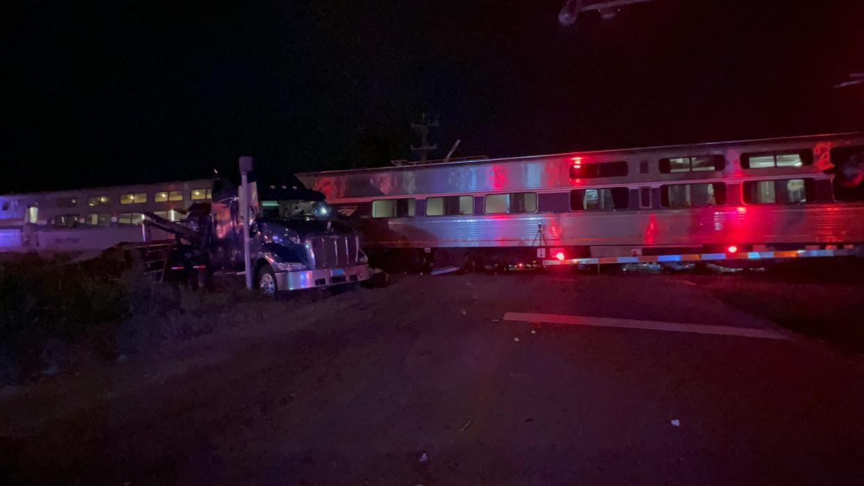 The scene of a crash Friday night in which an Amtrak train collided with a tractor-trailer that was carrying automobiles on North Canal Avenue in Lakeland.