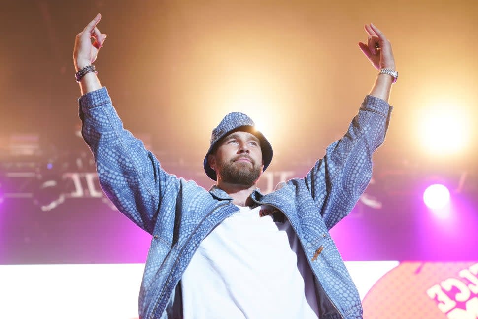 Travis Kelce, of the Kansas City Chiefs, entertains the crowd during Kelce Jam at Azura Amphitheater on April 28, 2023 in Bonner Springs, Kansas.