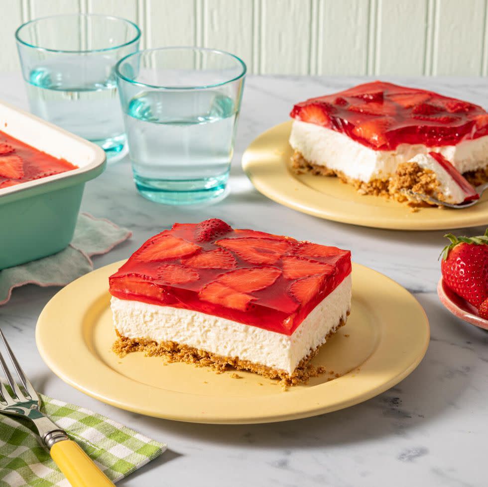 strawberry pretzel salad slice on yellow plate