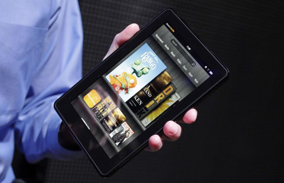 FILE - This Wednesday, Sept. 28, 2011 file photo shows the Kindle Fire at a news conference in New York. The tablet computer is without a doubt the gift of the year. just like it was last year. But if you resisted the urge in 2011, now is the time to give in. This season's tablets are better all around. Intense competition has kept prices very low, making tablets incredible values compared to smartphones and PCs (AP Photo/Mark Lennihan, File)