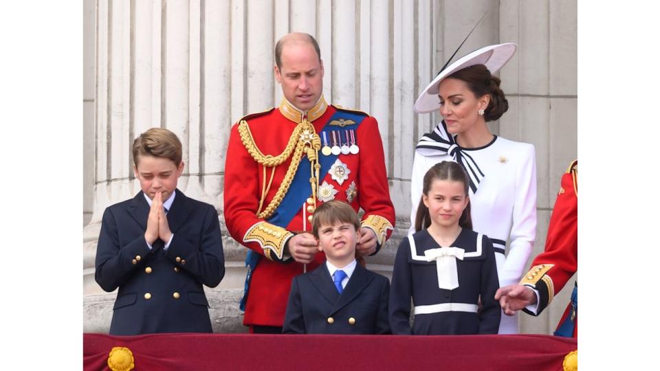 William tickling Louis' ears