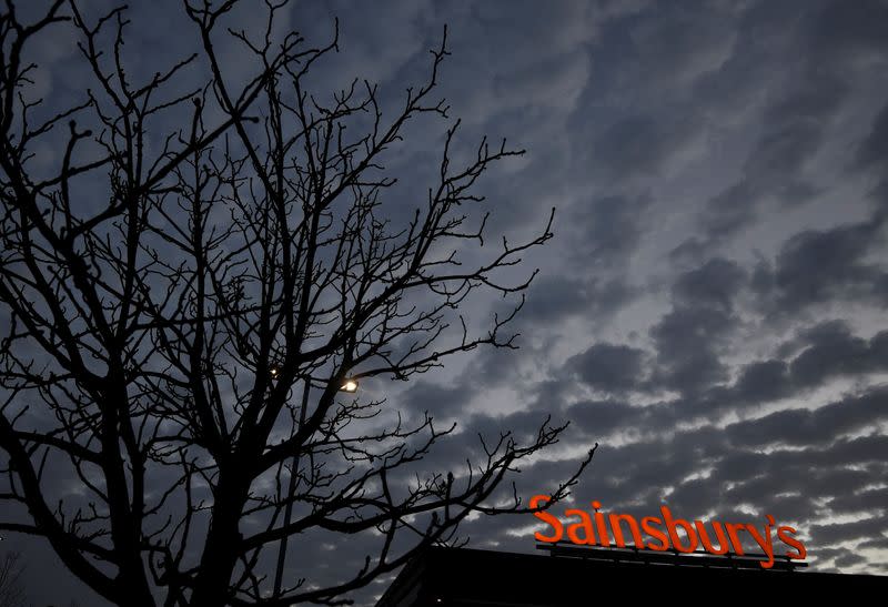 Signage for Sainsbury's is seen at a branch of the supermarket in London