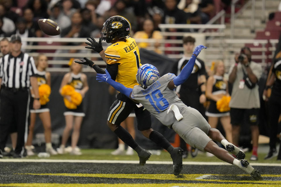 Missouri wide receiver Theo Wease Jr. (1) catches a touchdown pass as Memphis defensive back DeAgo Brumfield (18) defends during the second half of an NCAA college football game Saturday, Sept. 23, 2023, in St. Louis. (AP Photo/Jeff Roberson)