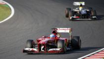 Ferrari Formula One driver Fernando Alonso of Spain races during the Japanese F1 Grand Prix at the Suzuka circuit October 13, 2013. REUTERS/Issei Kato (JAPAN - Tags: SPORT MOTORSPORT F1)