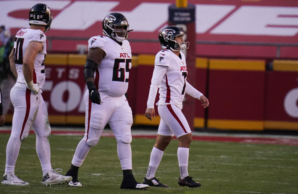 Atlanta Falcons place kicker Younghoe Koo, right, walks off the field after missing a 39-yard field goal during the second half of an NFL football game, Sunday, Dec. 27, 2020, in Kansas City. The Chiefs defeated the Falcons 17-14. (AP Photo/Jeff Roberson)