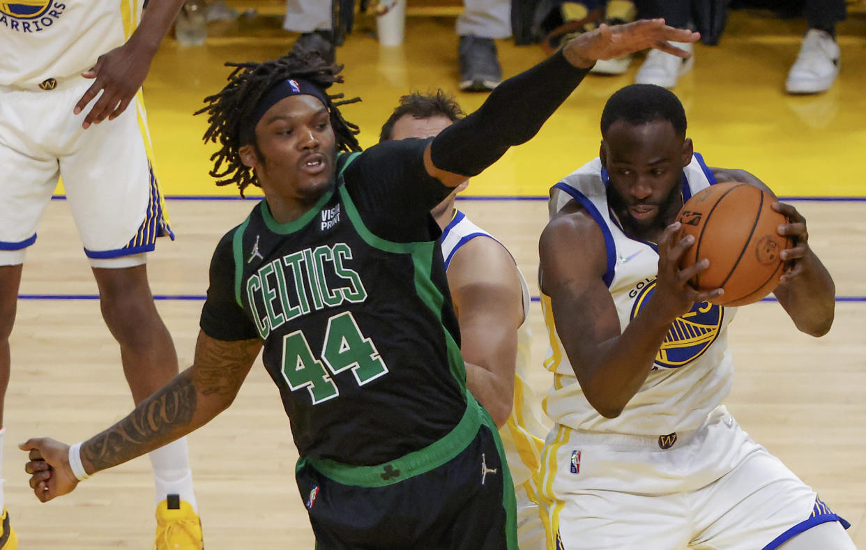 Boston Celtics center Robert Williams III defends Golden State Warriors forward Draymond Green during Game 5 of the 2022 NBA Finals at Chase Center in San Francisco on June 13, 2022. (Matthew J. Lee/The Boston Globe via Getty Images)