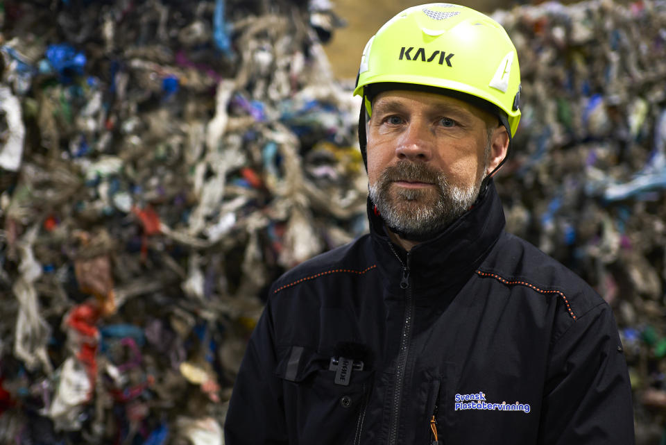 Mattias Philipsson, CEO of Swedish Plastic Recycling poses in front of plastic waste, stored in a new plastic waste sorting facility in Motala, central Sweden, Thursday, Nov. 9, 2023. Sweden launched a new state-of-the-art plastic sorting facility, the largest of its kind in the world, and big enough to receive all plastic packaging waste generated from Swedish households. (AP Photo/David Keyton)