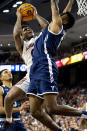 Auburn guard K.D. Johnson (0) collides with Yale guard Jalen Gabbidon (0) during the first half of an NCAA college basketball game, Saturday, Dec. 4, 2021, in Auburn, Ala. (AP Photo/Vasha Hunt)