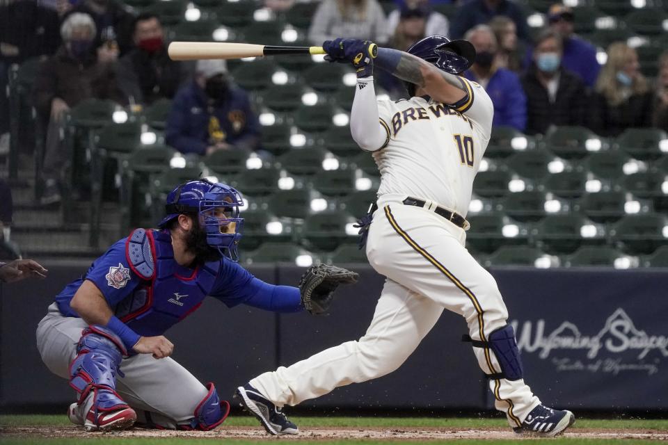 Milwaukee Brewers' Omar Narvaez hits a run-scoring sacrifice fly during the first inning of a baseball game against the Chicago Cubs Wednesday, April 14, 2021, in Milwaukee. (AP Photo/Morry Gash)