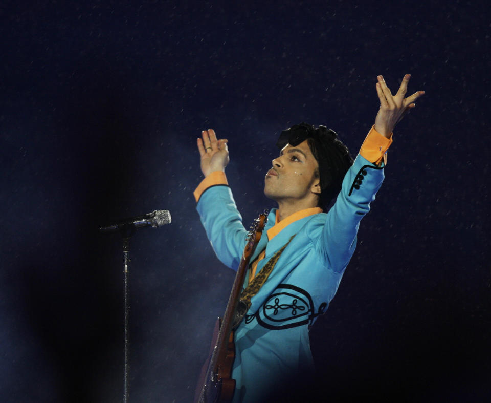 FILE- In this Feb. 4, 2007, file photo, Prince performs during the halftime show at Super Bowl XLI at Dolphin Stadium in Miami. On Friday, June 19, 2020, his “Blue Angel” Cloud 2 custom made electric guitar shot past the top estimate of $200,000 it was expected to fetch at the Music Icons sale at Julien's Auctions in Culver City, Calif. (AP Photo/Alex Brandon, File)