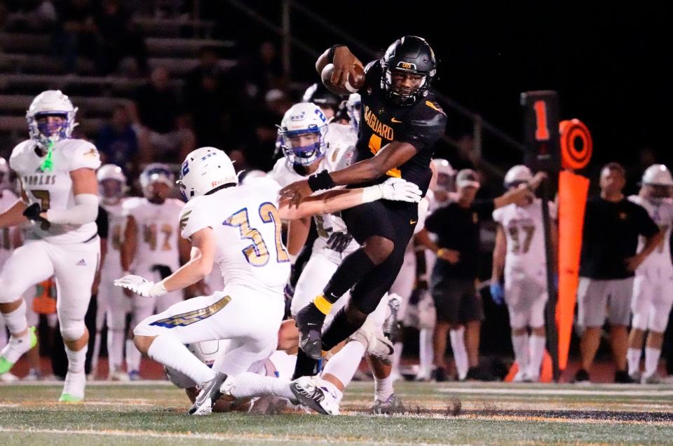 Sep 16, 2022; Scottsdale, Arizona, USA; Saguaro Sabercats quarterback Devon Dampier (4) carries the ball against the Sandra Day O'Connor Eagles during a game played at Saguaro High.