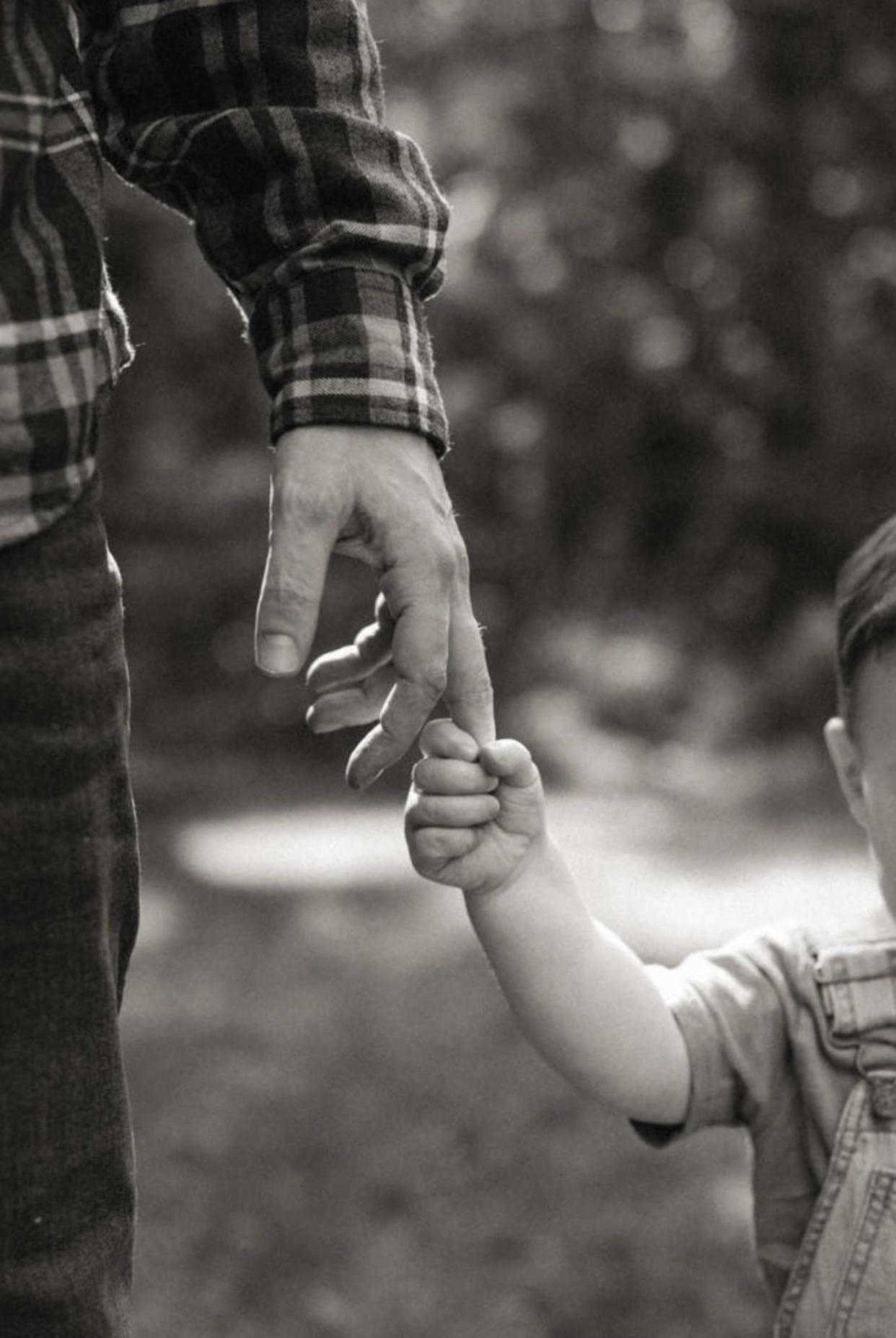 Jb Parke holds hands with his firstborn son. (Courtesy Haley Parke)