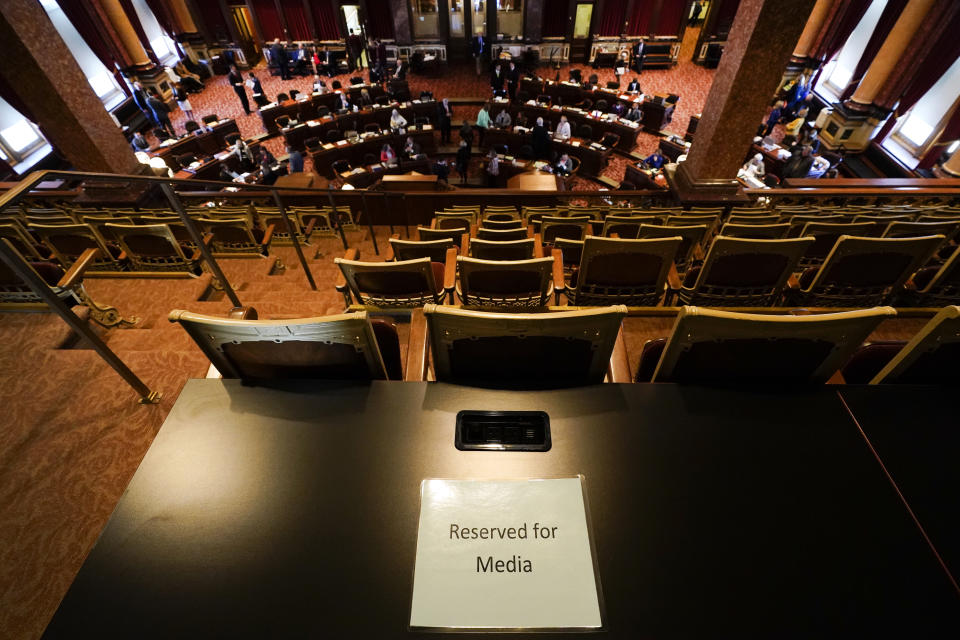 FILE - A Reserved for Media sign sits on a table in the Iowa Senate gallery during the opening day of the Iowa Legislature on Jan. 10, 2022, at the Statehouse in Des Moines, Iowa. Utah's state Senate passed rules this week limiting where the press can go to report in statehouses, marking the latest move by Republican state lawmakers departing from centuries-old traditions to make pandemic-era limits on access to chambers permanent. Rules governing where journalists can work vary across the nation's 50 statehouses. But in states such as Utah, Kansas and Iowa, reporters accustomed to reporting from the floor of legislative chambers are being restricted to public galleries. (AP Photo/Charlie Neibergall, File)