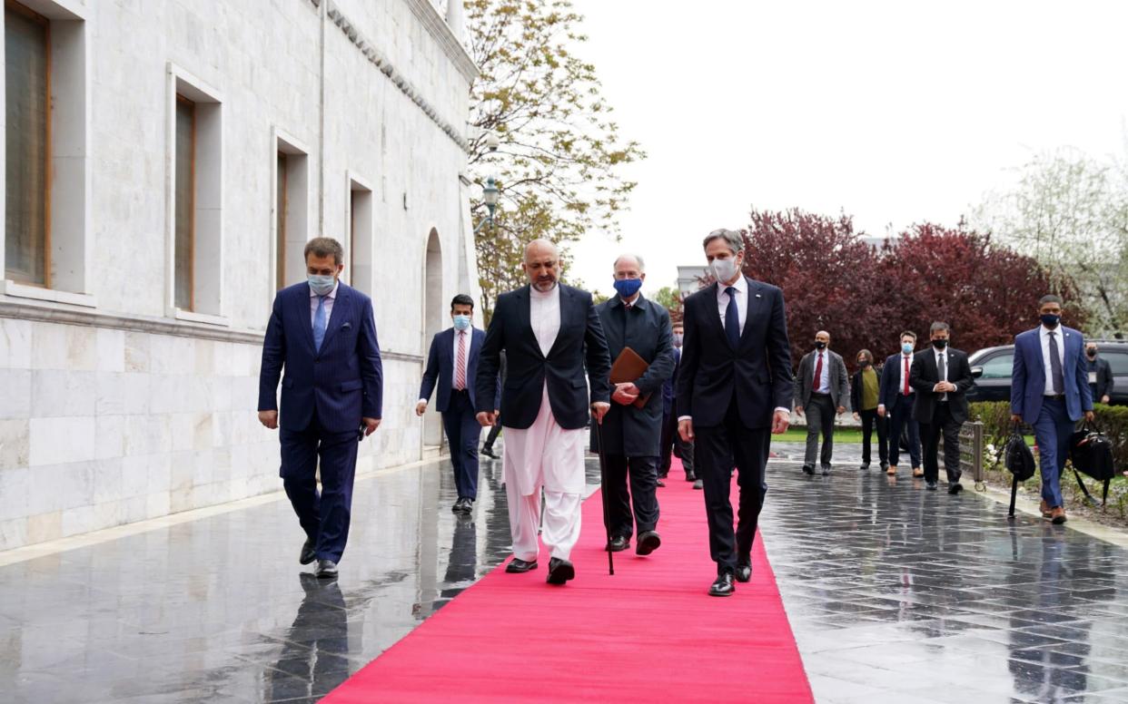 Editorial use only. HANDOUT /NO SALES Mandatory Credit: Photo by PRESIDENTIAL PALACE HANDOUT/EPA-EFE/Shutterstock (11860161f) A handout photo made available by the Presidential Palace shows U.S. Secretary of State Antony Blinken (C-R), walking with Afghanistan's Foreign Minister Mohammad Hanif Atmar (C-L), at the presidential palace in Kabul, Afghanistan, 15 April 2021