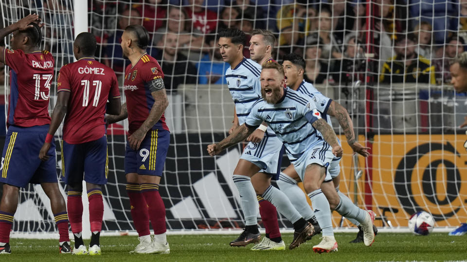 Sporting Kansas City forward Johnny Russell, front right, celebrates with teammates after Erik Thommy's goal against Real Salt Lake during the first half of an MLS soccer match Saturday, Oct. 7, 2023, in Sandy, Utah. (AP Photo/Rick Bowmer)