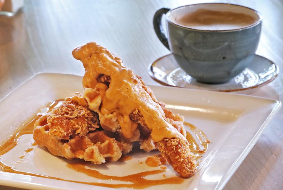 Chicken and waffles with a latte at Sunrise Social in Green.