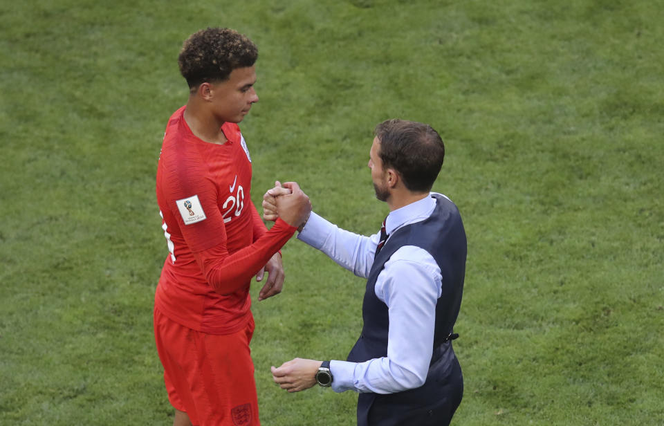 <p>England head coach Gareth Southgate shakes hands with England’s Dele Alli after he was substituted </p>