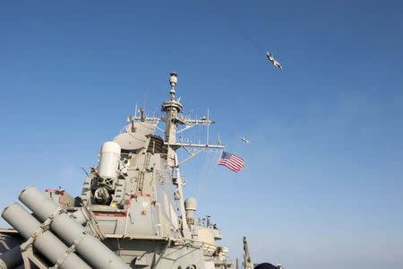 An U.S. Navy picture shows what appears to be a Russian Sukhoi SU-24 attack aircraft flying over the U.S. guided missile destroyer USS Donald Cook in the Baltic Sea in this picture taken April 12, 2016 and released April 13, 2016. REUTERS/US Navy/Handout via Reuters