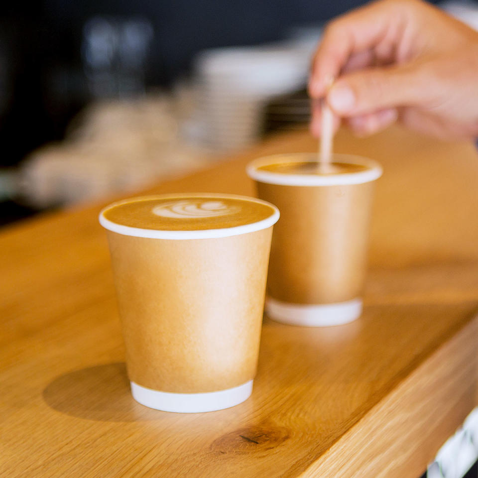 Hand stirring coffees