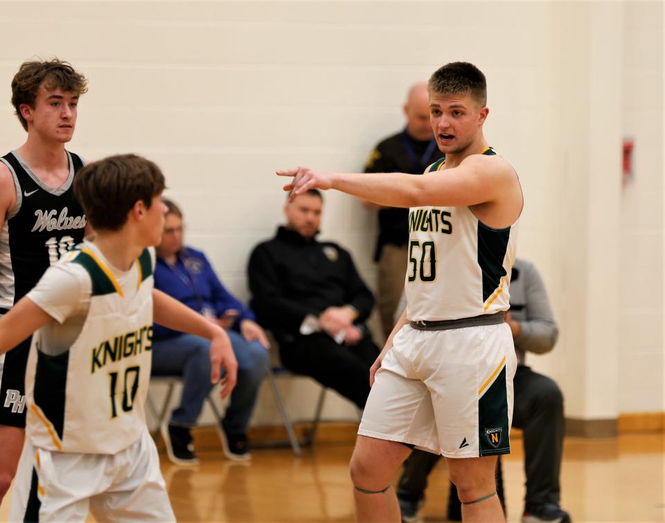 Northeastern senior Caleb Harmon directs traffic during a regional championship game against Parke Heritage March 11, 2023.