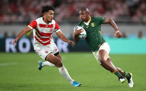 Makazole Mapimpi of South Africa (R) runs with the ball from Ryohei Yamanaka of Japan during the Rugby World Cup 2019 Quarter Final match between Japan and South Africa at the Tokyo Stadium on October 20, 2019 in Chofu, Tokyo, Japan - Credit: Getty Images