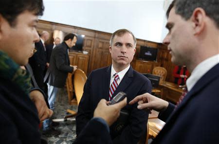 U.S. prosecutors Marshall Miller (C) and William Nardini (R) talk with a reporter at the end of a news conference in Rome February 11, 2014. REUTERS/Tony Gentile