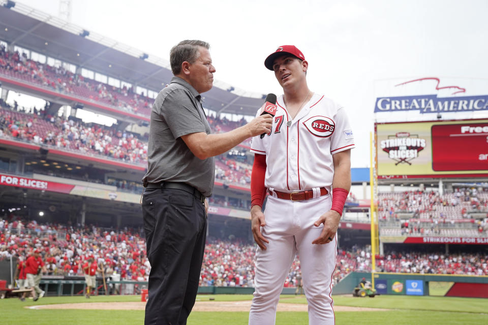 Cincinnati Reds' Tyler Stephenson, right, does an interview with Bally Sports broadcaster Jim Day following a baseball game against the San Diego Padres, Sunday, July 2, 2023, in Cincinnati. (AP Photo/Jeff Dean)