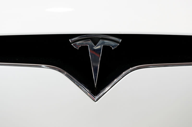 FILE PHOTO: The Tesla logo is seen at Autonomy and the Urban mobility summit in Paris, France, October 19, 2018. REUTERS/Benoit Tessier